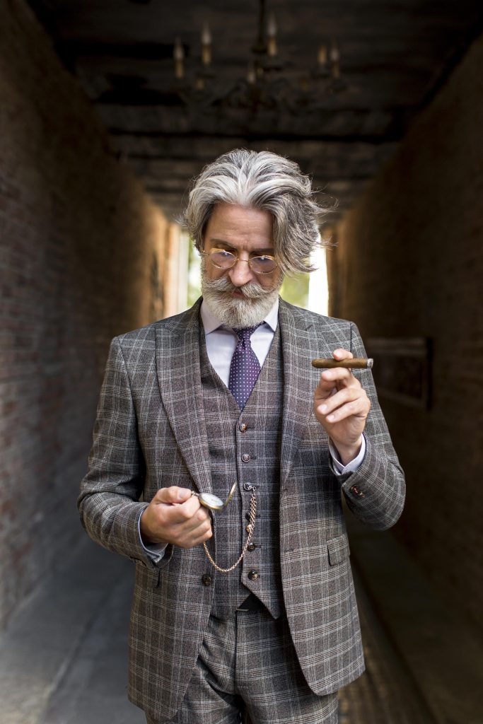 de dietrich pac portrait d'homme élégant en costume classique assis et posant